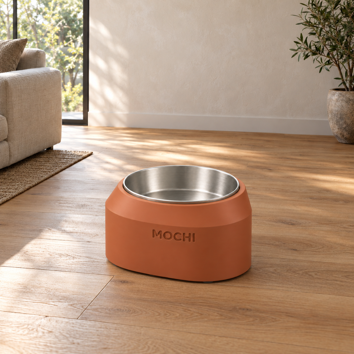 Terracotta Cove Smooth dog bowl styled in a home interior.