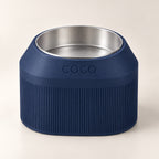 Cove Half Fluted custom-height dog bowl in Dark Blue, with a removable stainless-steel bowl; COCO is an example name