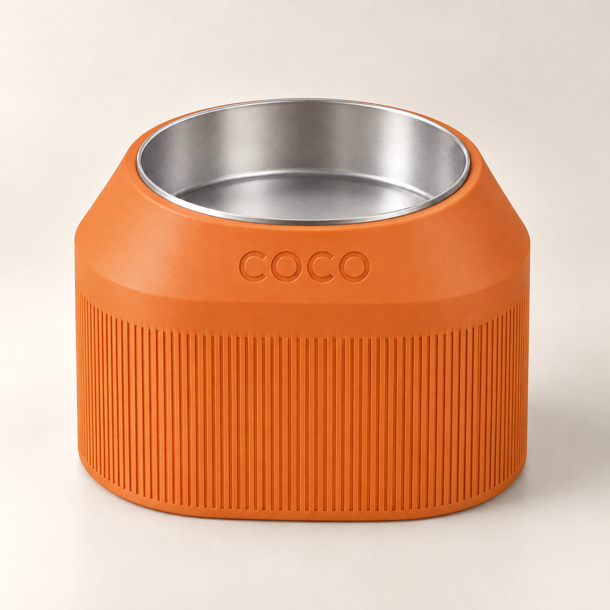Cove Half Fluted custom-height dog bowl in Mandarin Orange, with a removable stainless-steel bowl; COCO is an example name