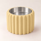 Petal Bold custom-height dog bowl in Desert Tan, with a removable stainless-steel bowl; no nameplate