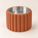 Petal Bold custom-height dog bowl in Terracotta, with a removable stainless-steel bowl; no nameplate