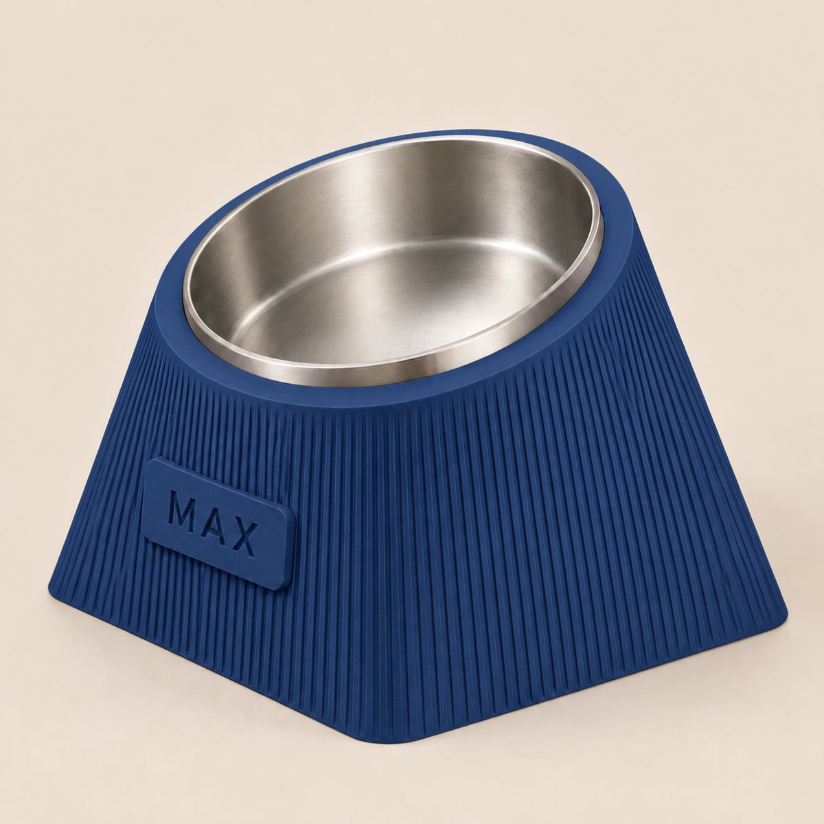 Contour Tilt custom height dog bowl in Dark Blue, with a tilted stainless steel bowl, fine vertical grooves and MAX example nameplate.