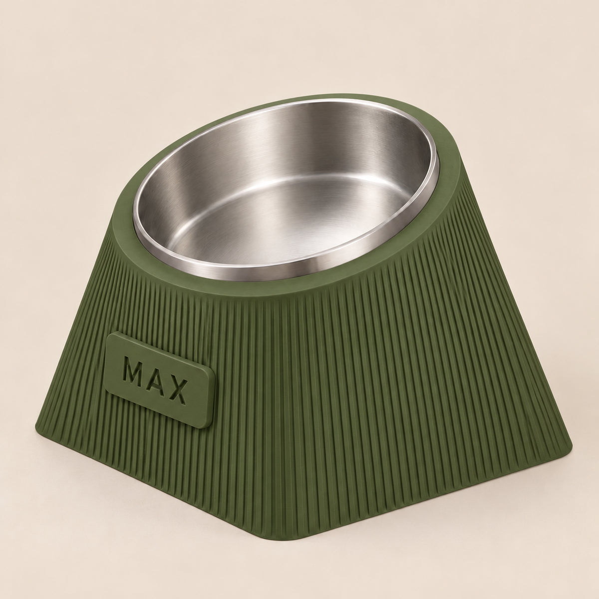 Contour Tilt custom height dog bowl in Dark Green, with a tilted stainless steel bowl, fine vertical grooves and MAX example nameplate.