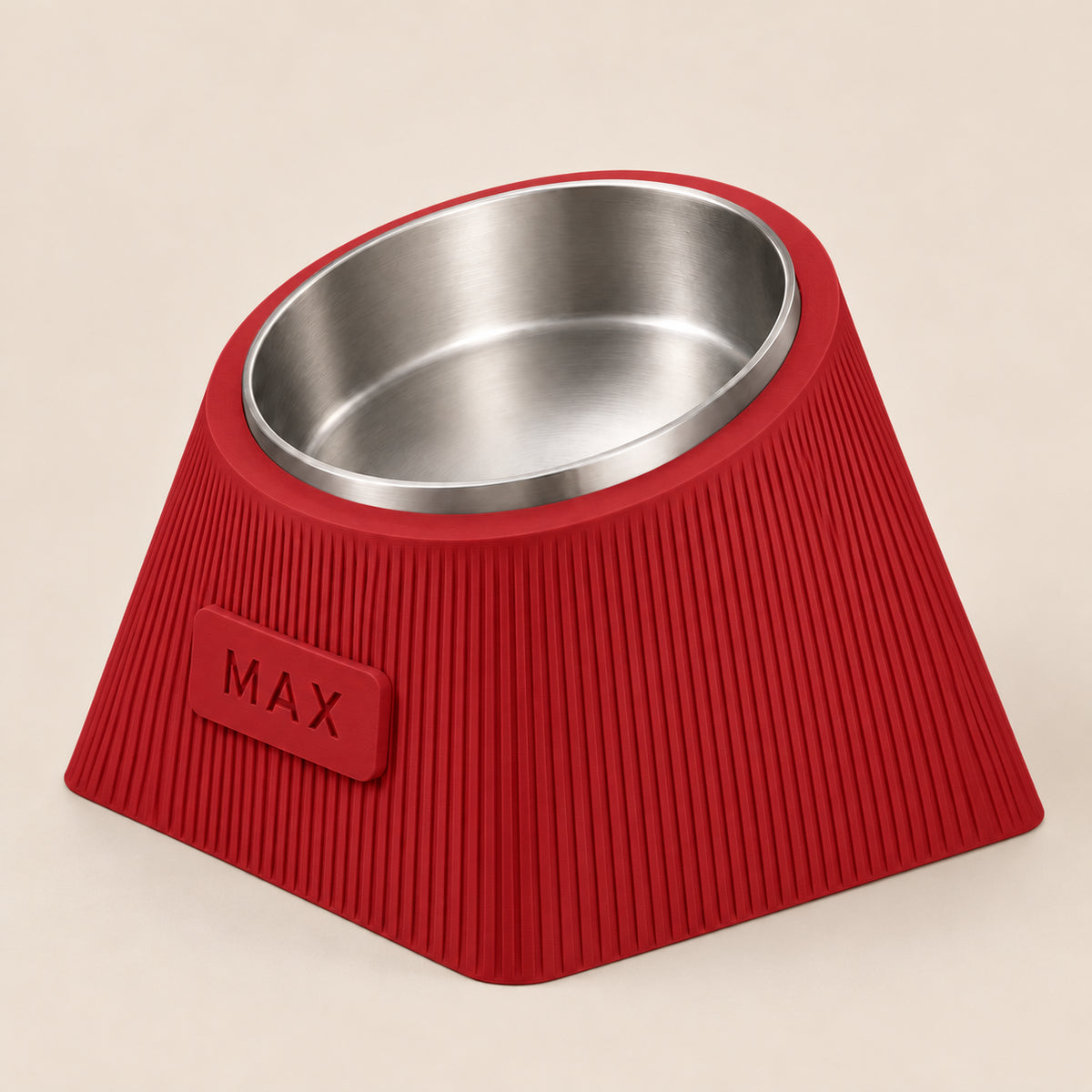 Contour Tilt custom height dog bowl in Dark Red, with a tilted stainless steel bowl, fine vertical grooves and MAX example nameplate.