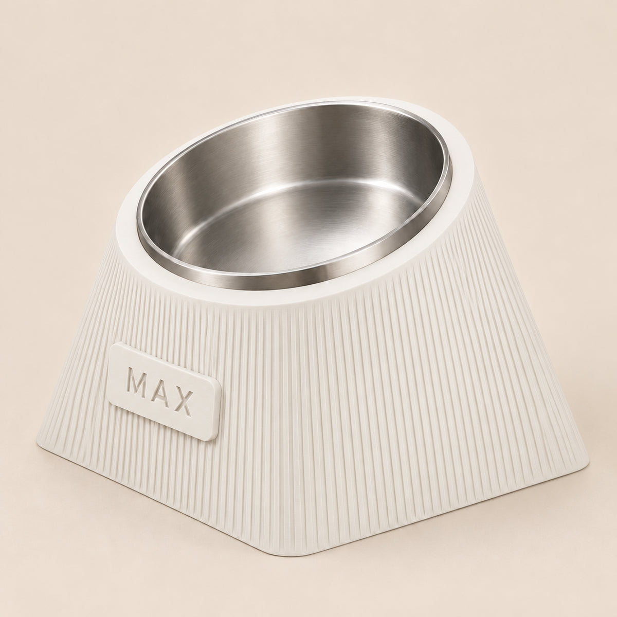 Contour Tilt custom height dog bowl in Ivory White, with a tilted stainless steel bowl, fine vertical grooves and MAX example nameplate.