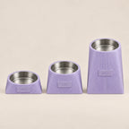 Three Lilac Purple Contour Tilt holders at different heights; illustrative comparison, not a size or measurement chart.