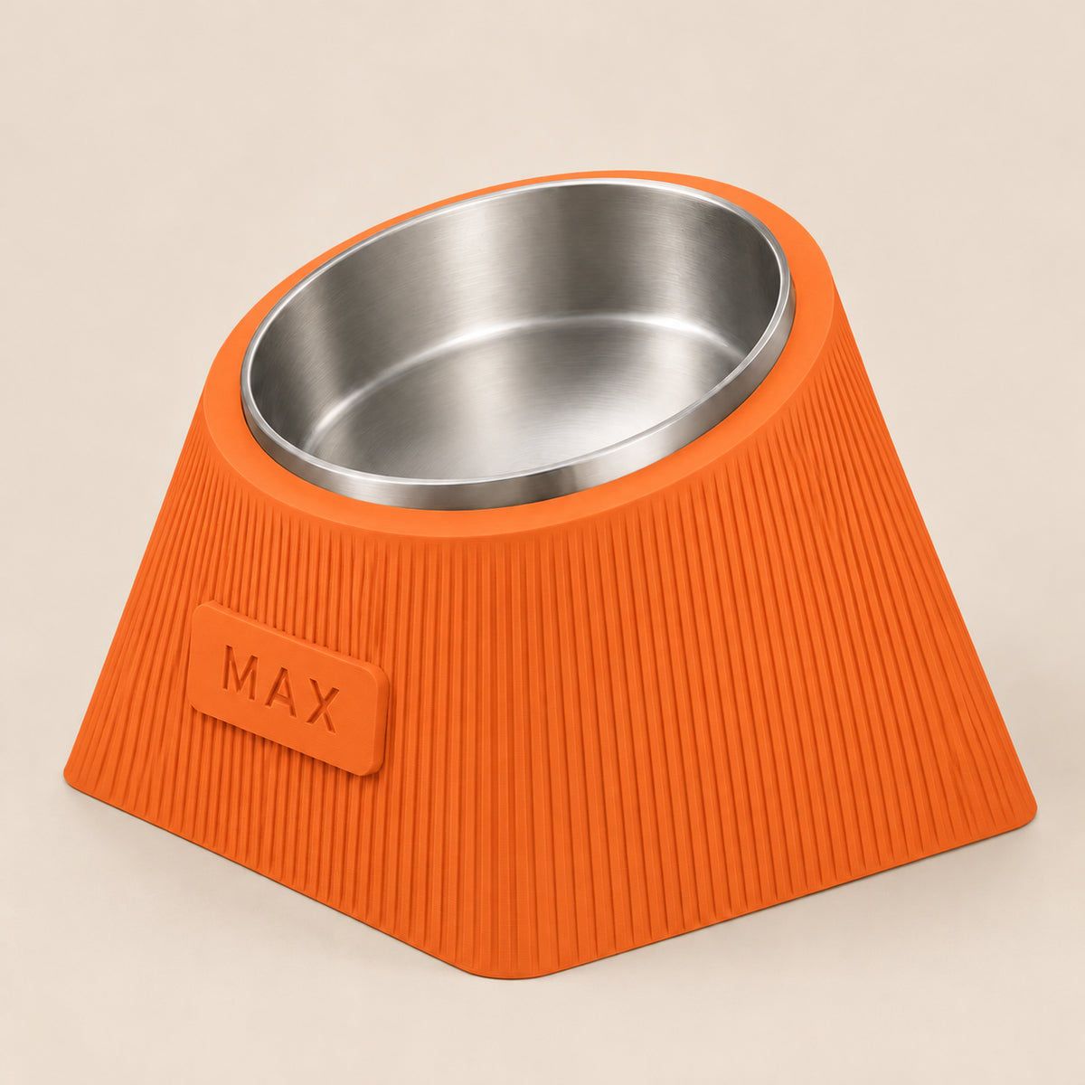 Contour Tilt custom height dog bowl in Mandarin Orange, with a tilted stainless steel bowl, fine vertical grooves and MAX example nameplate.