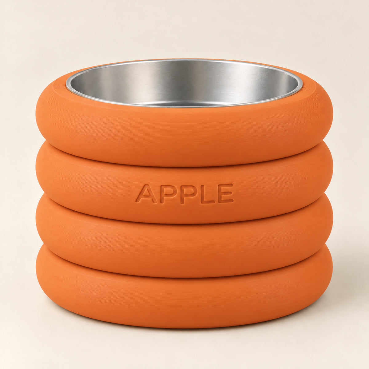 RingStack custom-height dog bowl in Mandarin Orange, with a removable stainless-steel bowl; APPLE is an example name
